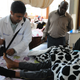 Omar Siddiqi attends to a patient